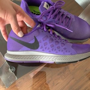Women’s 6 1/2 Nike Purple running shoes.